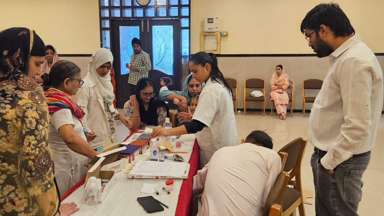 Medical staff preparing blood test samples at the Health Checkup Camp in Vapi